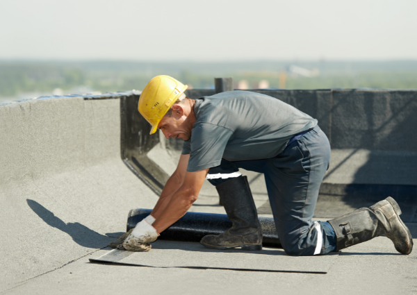 roofing contractor estimating flat roof